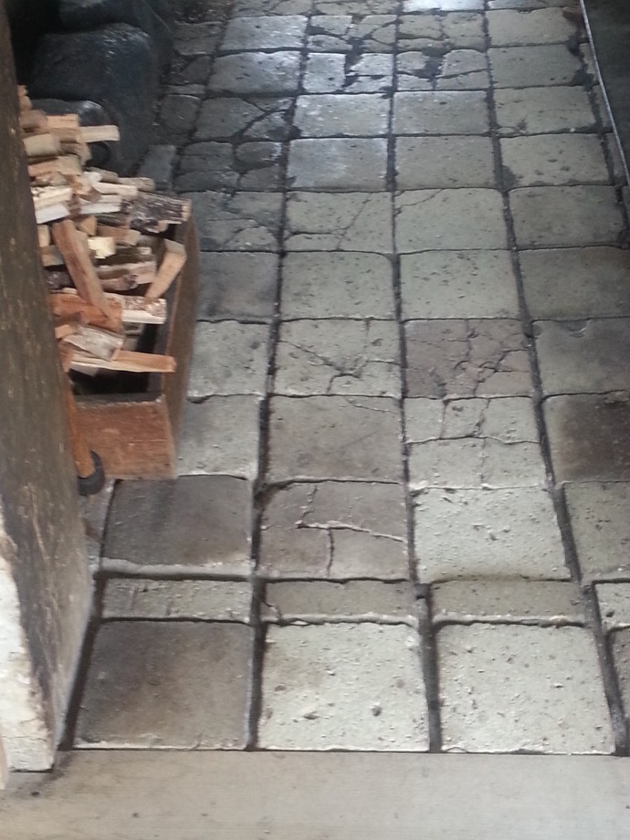 Wabi-Sabi Wonderland: cracked stone floor of a black kitchen at Old World Wisconsin by Jenny Hoople